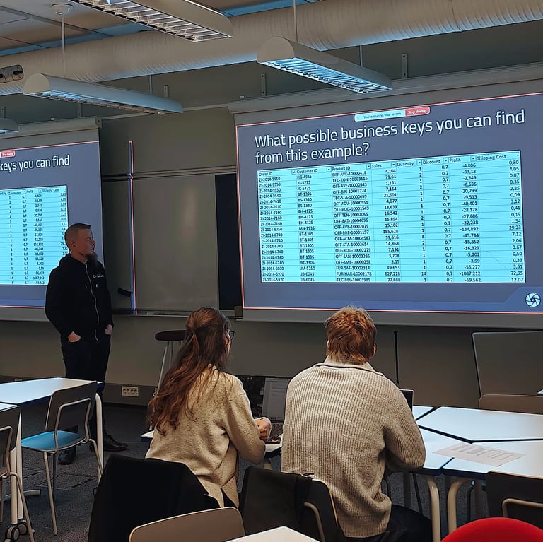 I generic picture from the classroom where learners are thinking the business keys from example data set.